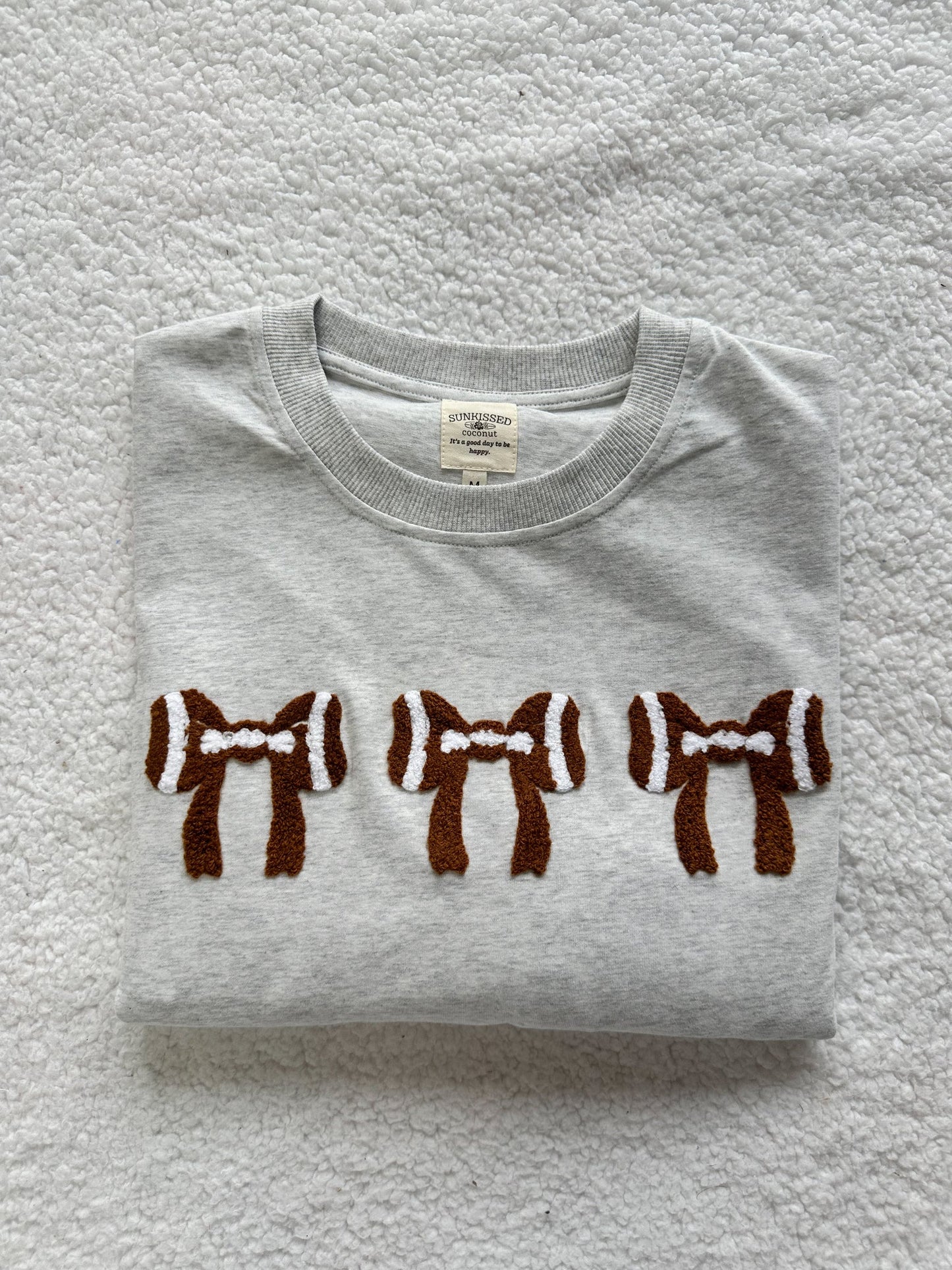 Sunkissed Coconut Football Bow Tee